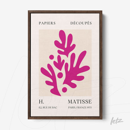 framed modern art piece in vibrant pink tones inspired by paper cut patterns with dark wooden frame