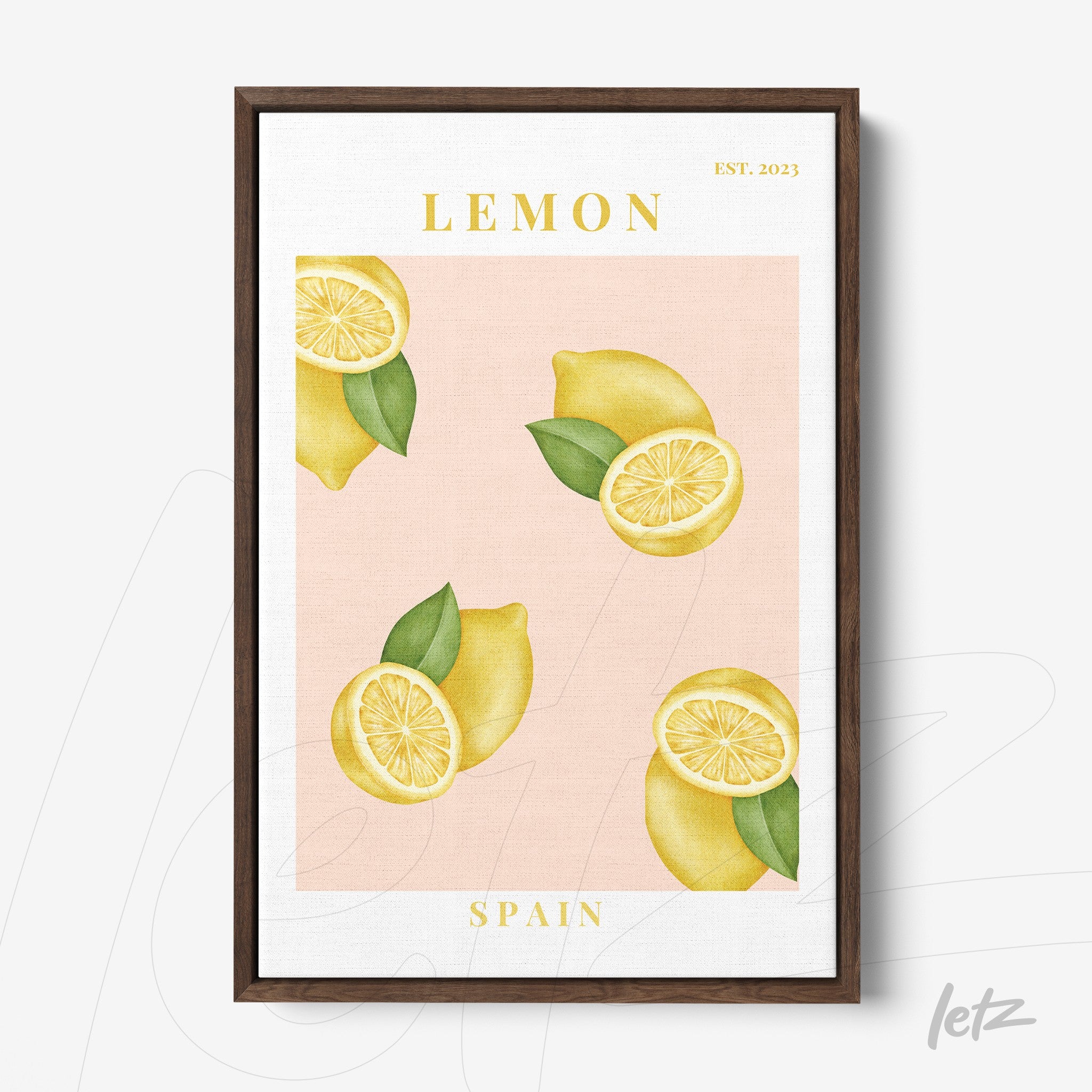framed artwork featuring lemons on a pink background with dark wood frame