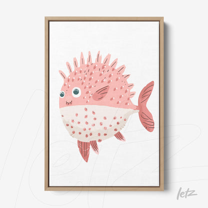 canvas print of a cute pink fish with spikes and big eyes in a light wood frame