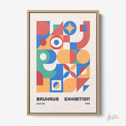 canvas print featuring colorful geometric Bauhaus-style art in a light wood frame