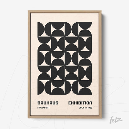 framed wall art with black and white Bauhaus style geometric pattern in light wood frame