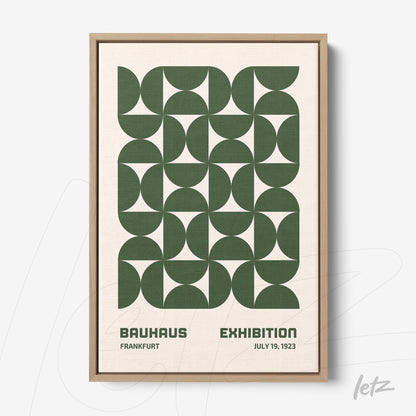 poster featuring green geometric design in natural wood frame displayed on white background