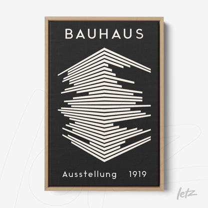 bauhaus style framed artwork featuring white geometric lines on a black background with light wood frame
