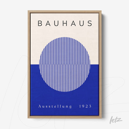 canvas print featuring bauhaus-inspired design with vertically striped circle in blue and white in light wood frame