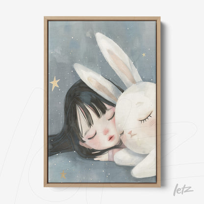 canvas print featuring an illustration of a girl with black hair and a white rabbit, light wooden frame, and a blue background with stars