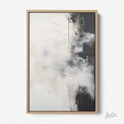 abstract wall art in white and black tones with light wood frame