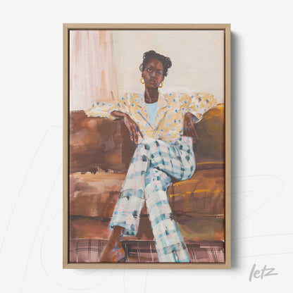 framed artwork featuring a portrait of a woman in floral patterned clothing sitting on a couch with light wood frame