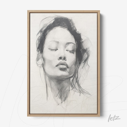 framed artwork featuring a gray-toned portrait of a serene woman with a light wood frame