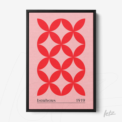 geometric art print in red on pink background with 'bauhaus 1919' text in black frame