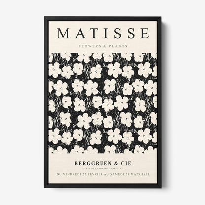 framed vintage style artwork featuring white flowers on a black background, with a sturdy black frame