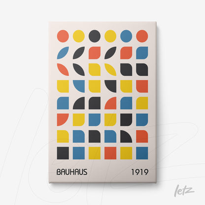 canvas print featuring a colorful geometric pattern inspired by Bauhaus, with circles, squares, and semicircles in red, yellow, blue, and black on a light background