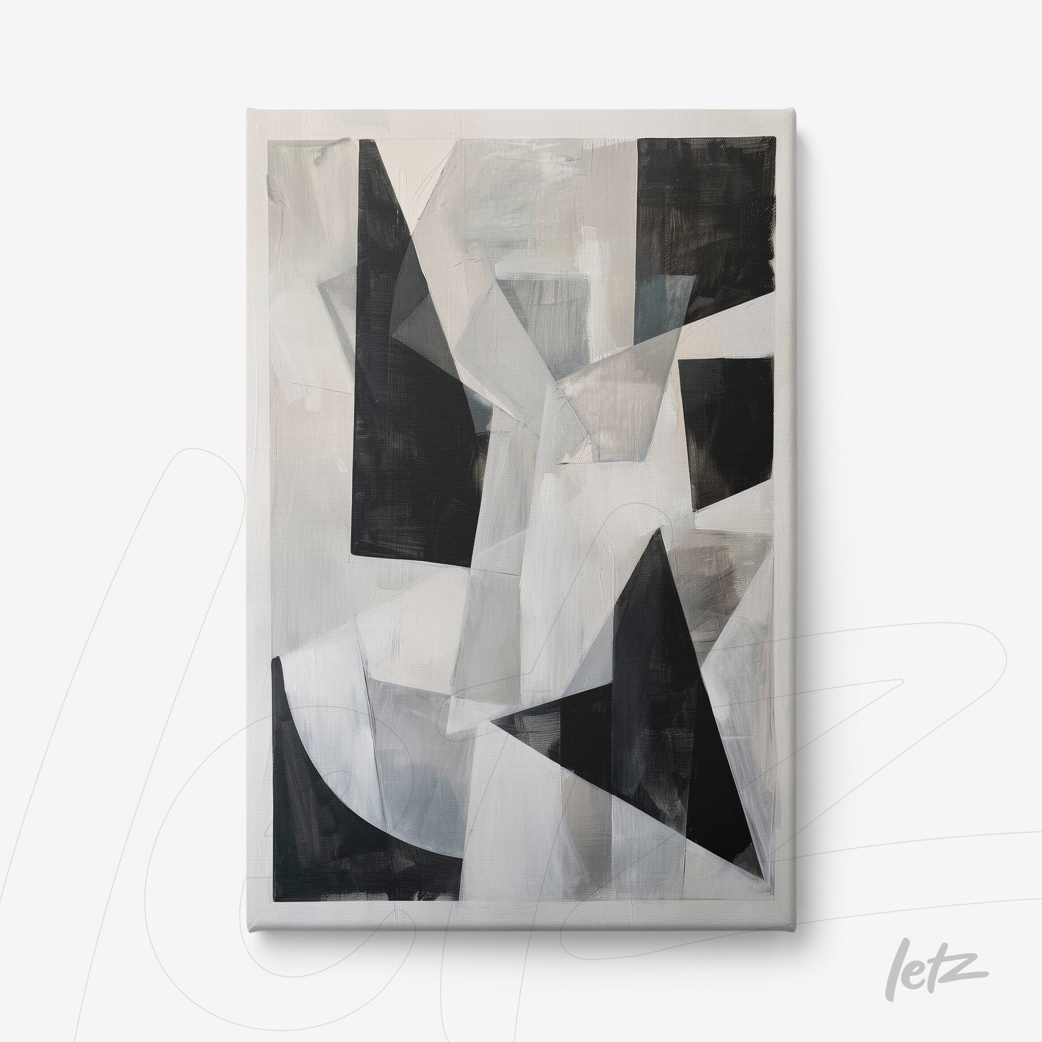 canvas artwork featuring abstract design in shades of black, white, and gray with asymmetric geometric shapes