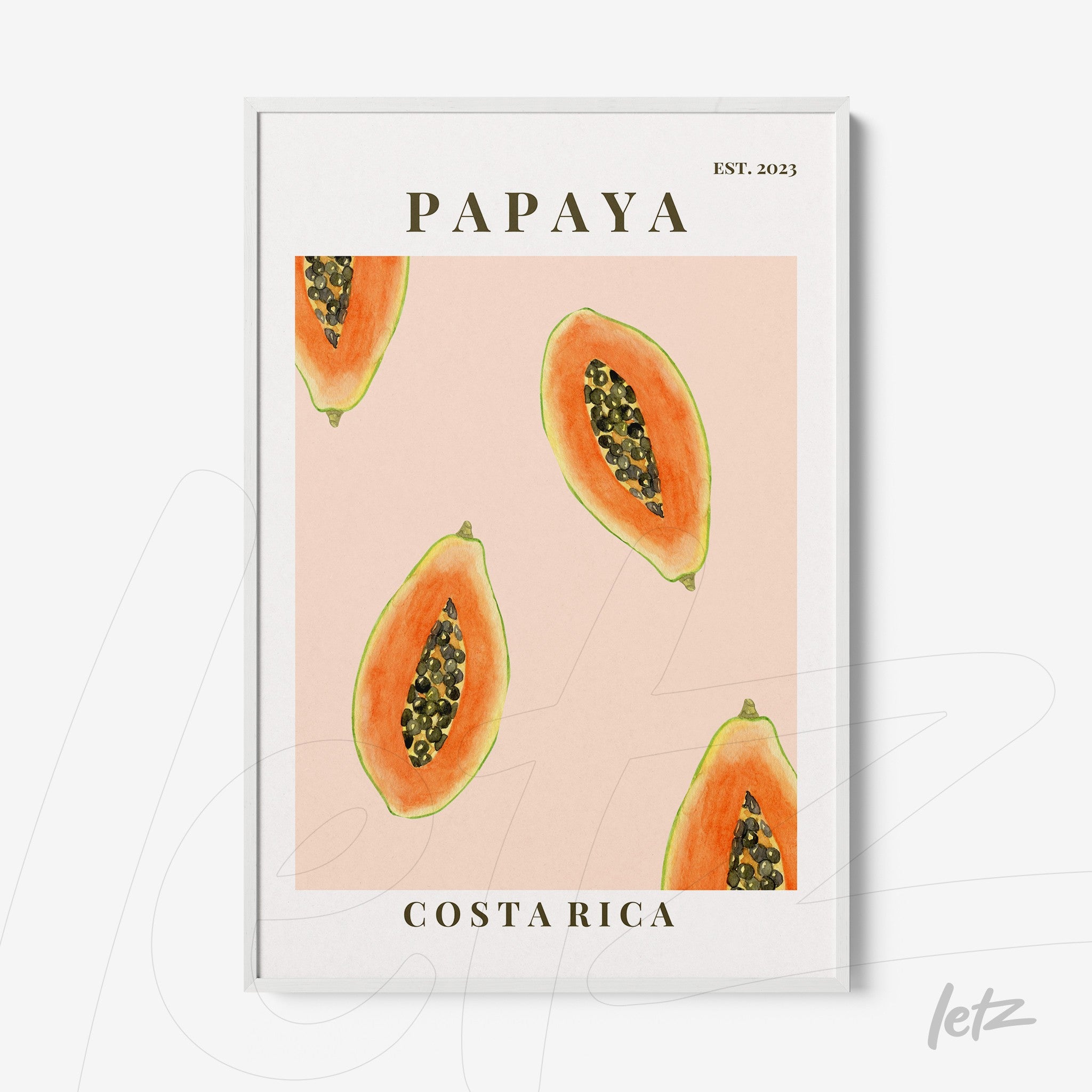 framed artwork featuring papaya slices on a pink background with white frame