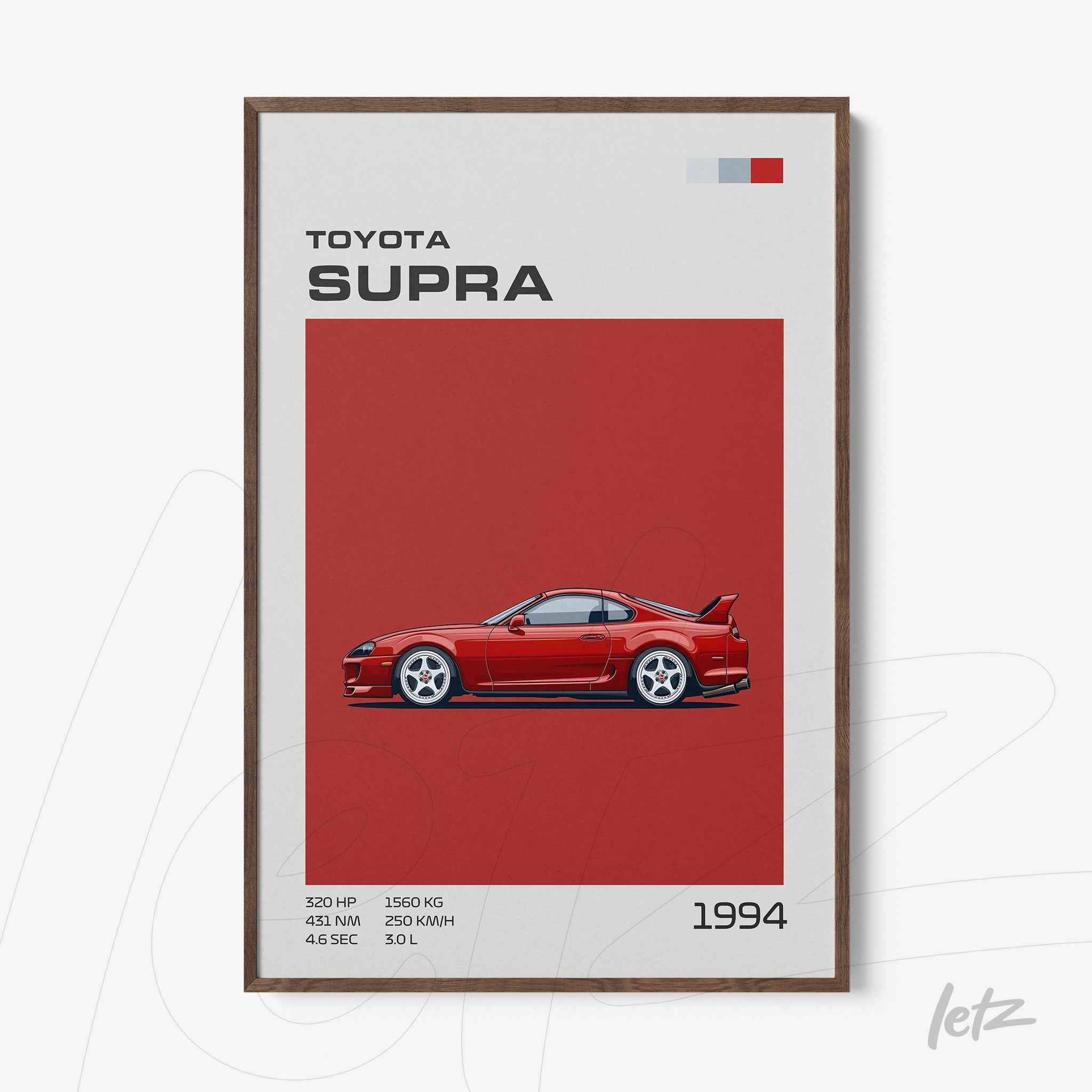 framed wall art featuring a stylized illustration of a Toyota Supra on a red background with dark wood frame and text details