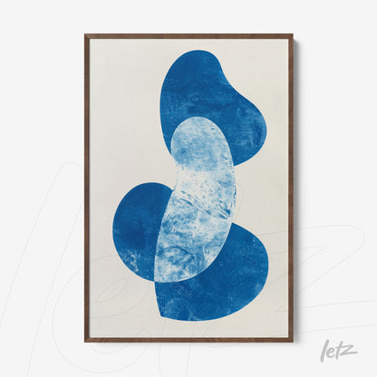 abstract wall art featuring organic blue shapes on a light background framed in dark wood