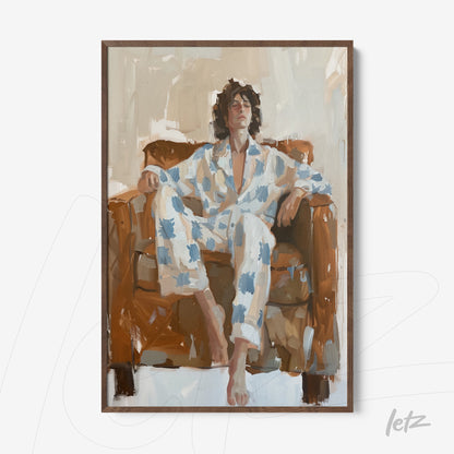 framed artwork of a man lounging on a brown sofa, wearing a white pajama set with blue splotches, set in a stylish dark wood frame
