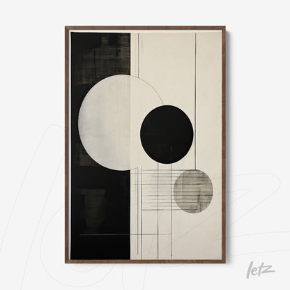 abstract wall art featuring black and white circles with dark wood frame