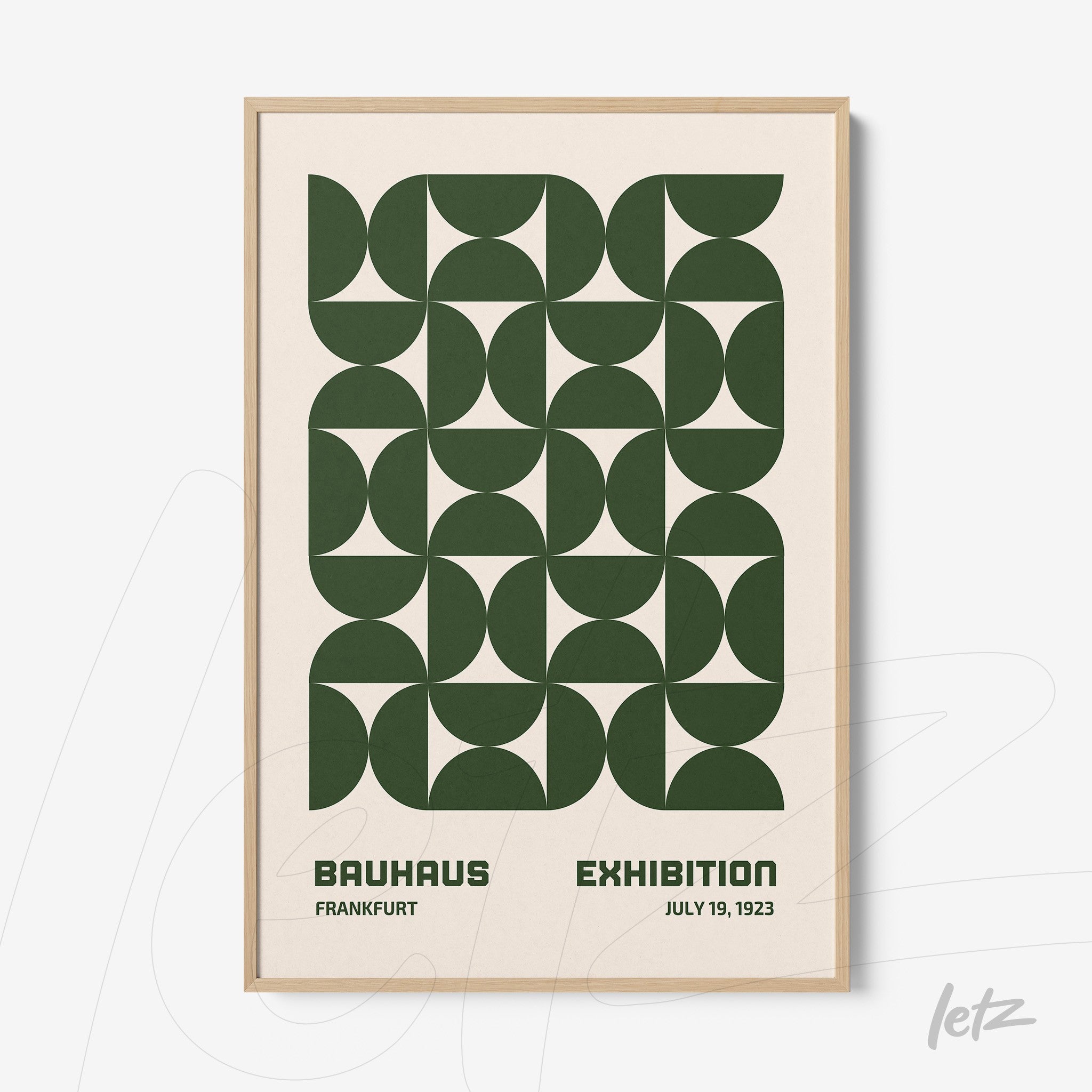 bauhaus style poster print featuring green geometric patterns in a light wood frame