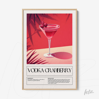 framed art print of a vodka cranberry cocktail with a light frame and vibrant pink background