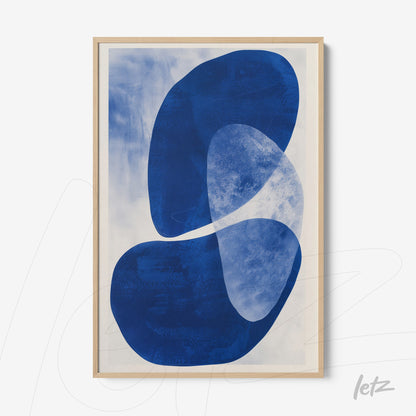 abstract wall art featuring blue organic shapes with a light wood frame
