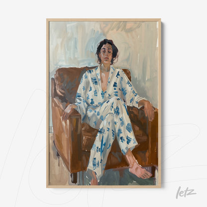 framed artwork depicting an expressive portrait of a woman sitting on a brown sofa, wearing a blue patterned pajama, with a light wood frame