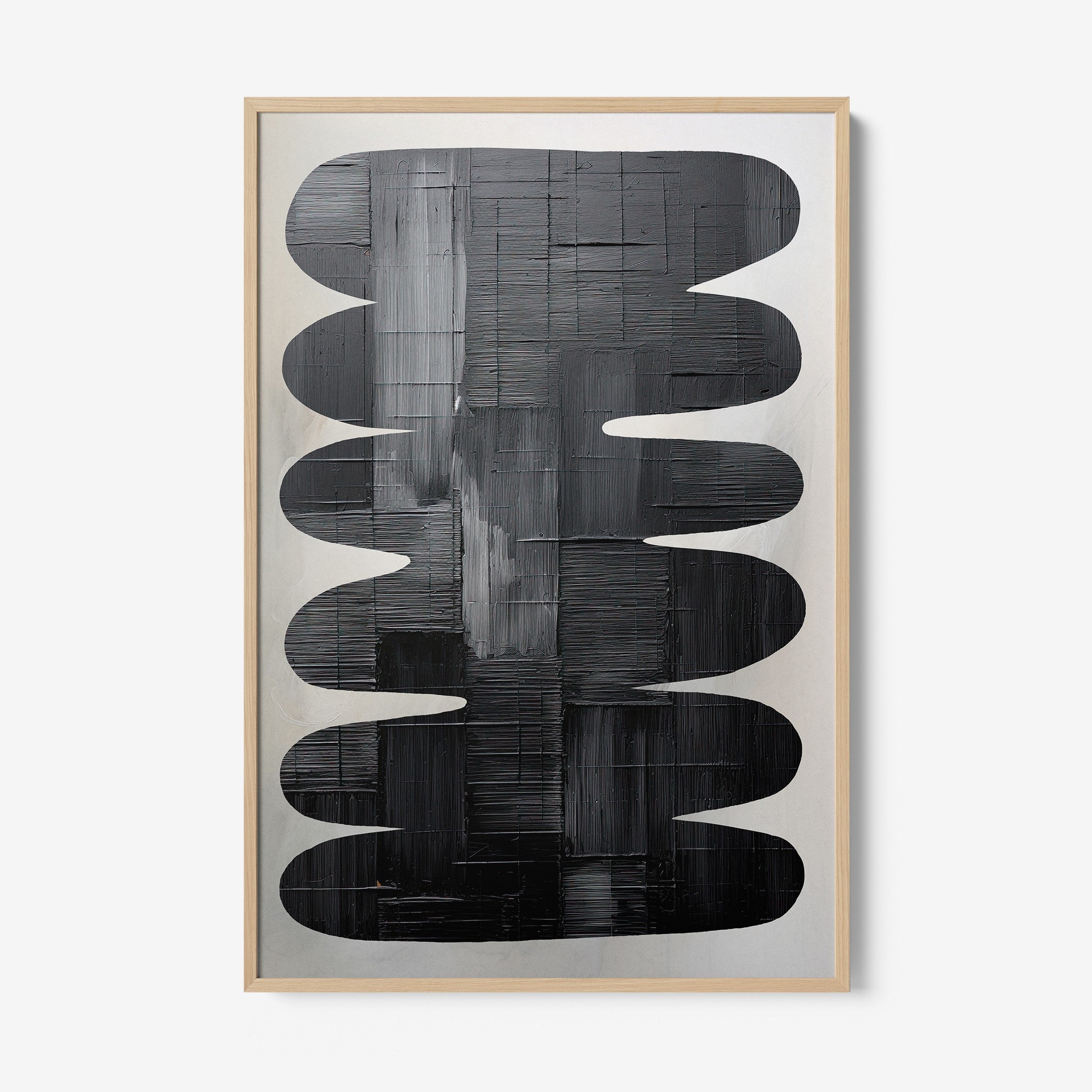 abstract art in black tones featuring organic shapes, framed in light wood