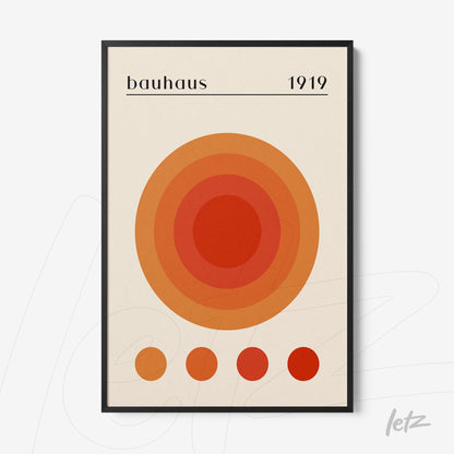 poster print featuring concentric orange circles in Bauhaus style from 1919, with a thin black frame
