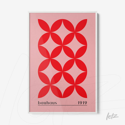 poster print with red geometric shapes on a pink background and white frame
