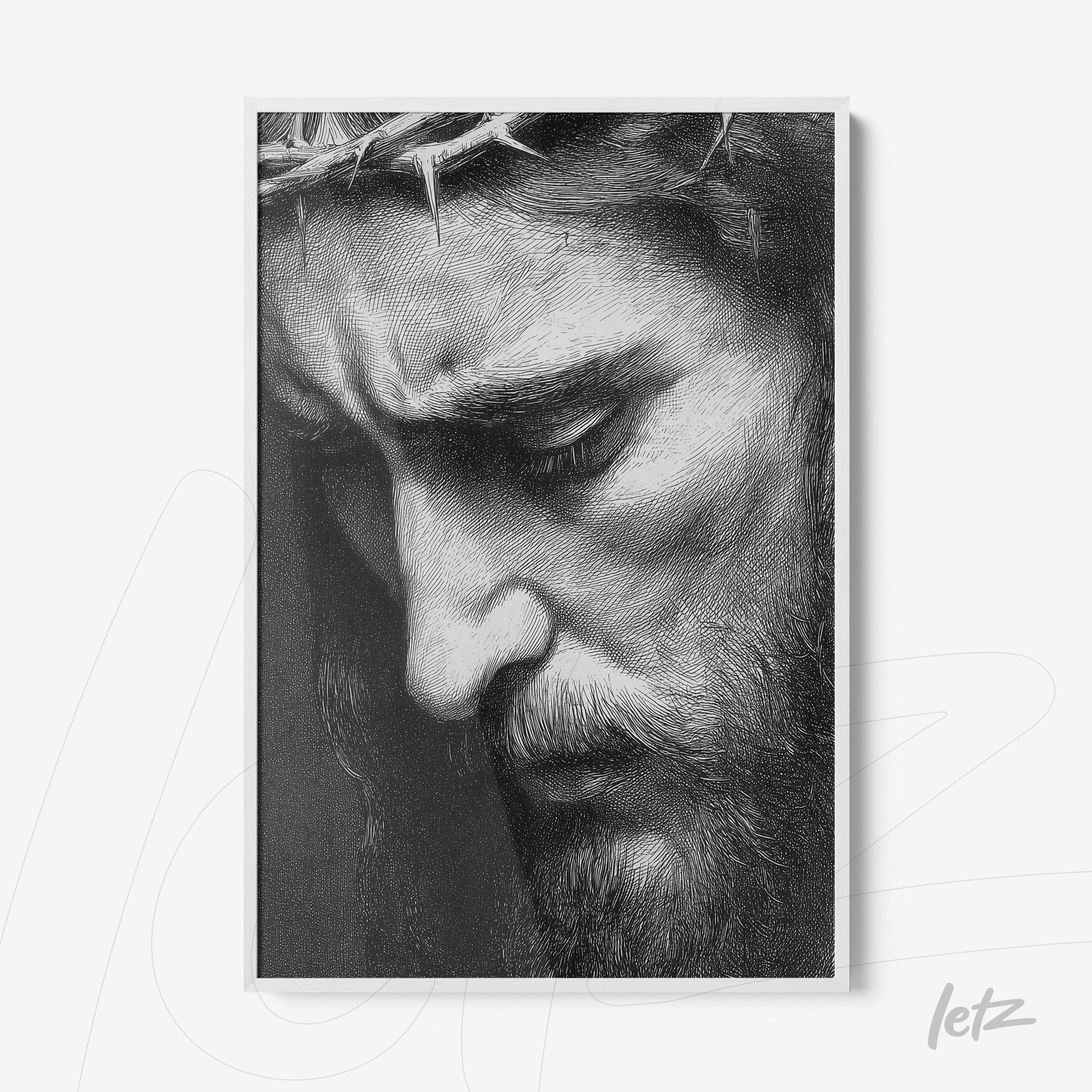 framed artwork featuring a black and white portrait of Christ with a serene expression and detailed beard and crown of thorns
