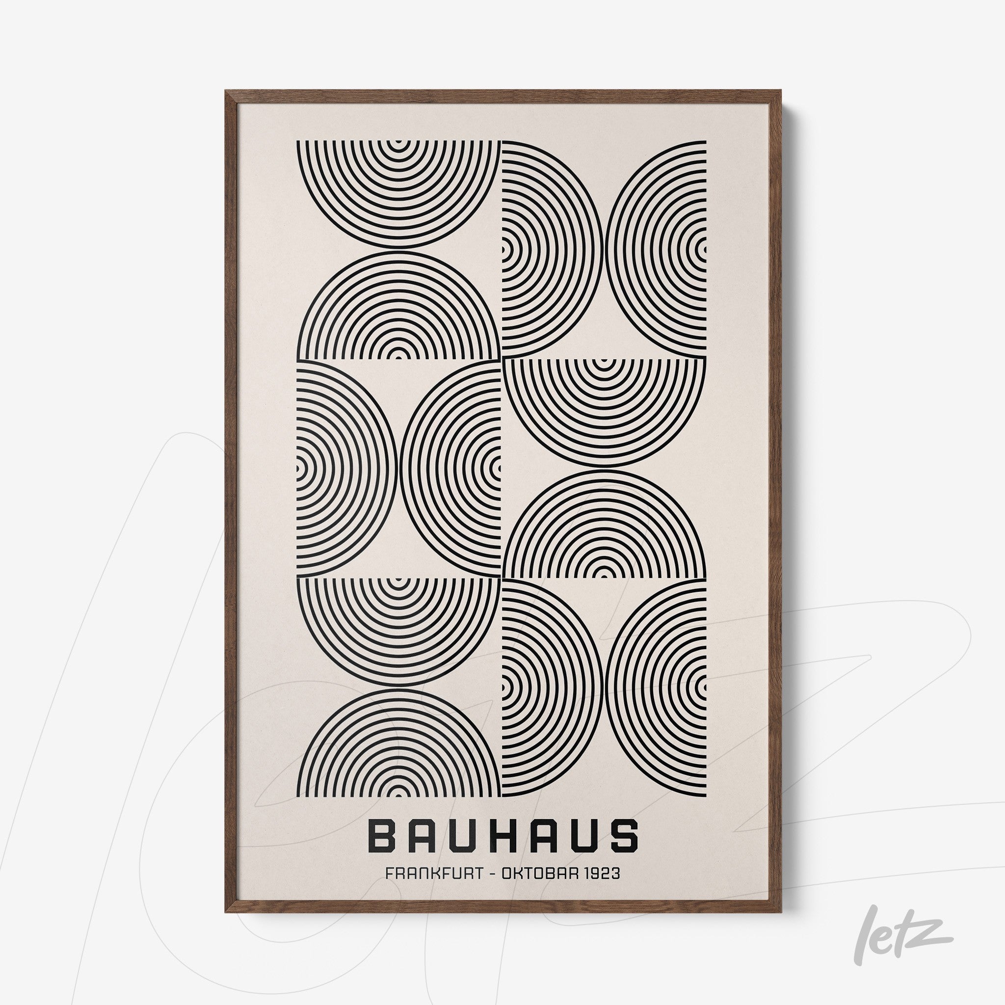 poster with black and white geometric pattern framed in dark wood