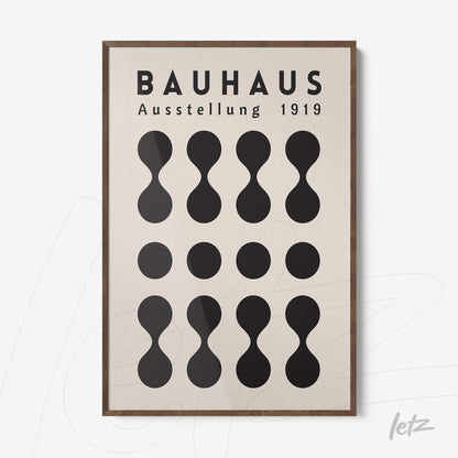poster print of abstract bauhaus design from 1919 with wooden frame, featuring organic shapes and german text on a light background