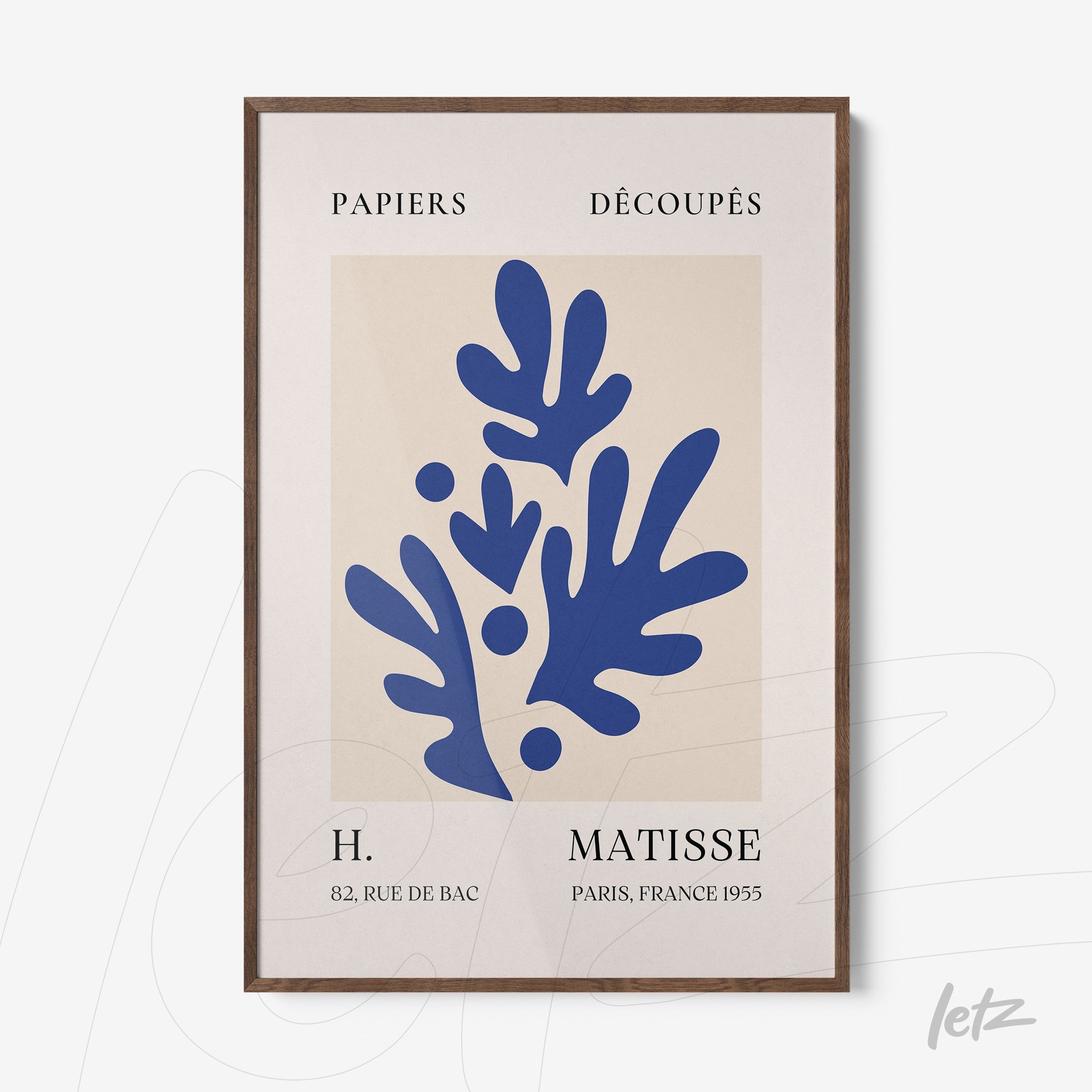 modern wall art featuring blue leaf shapes in dark wood frame