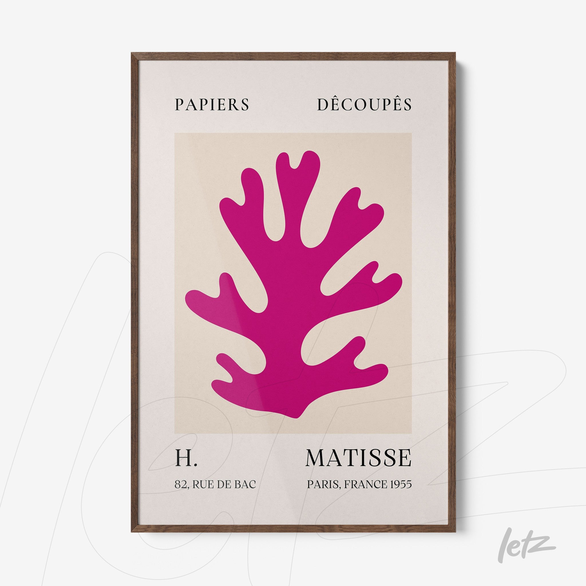 framed art print featuring a vibrant pink coral design with a dark wooden frame and light background