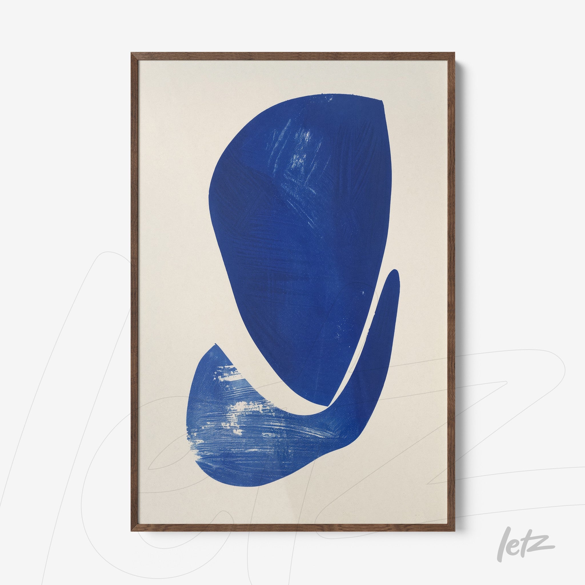 framed wall art featuring abstract shapes in blue on light background