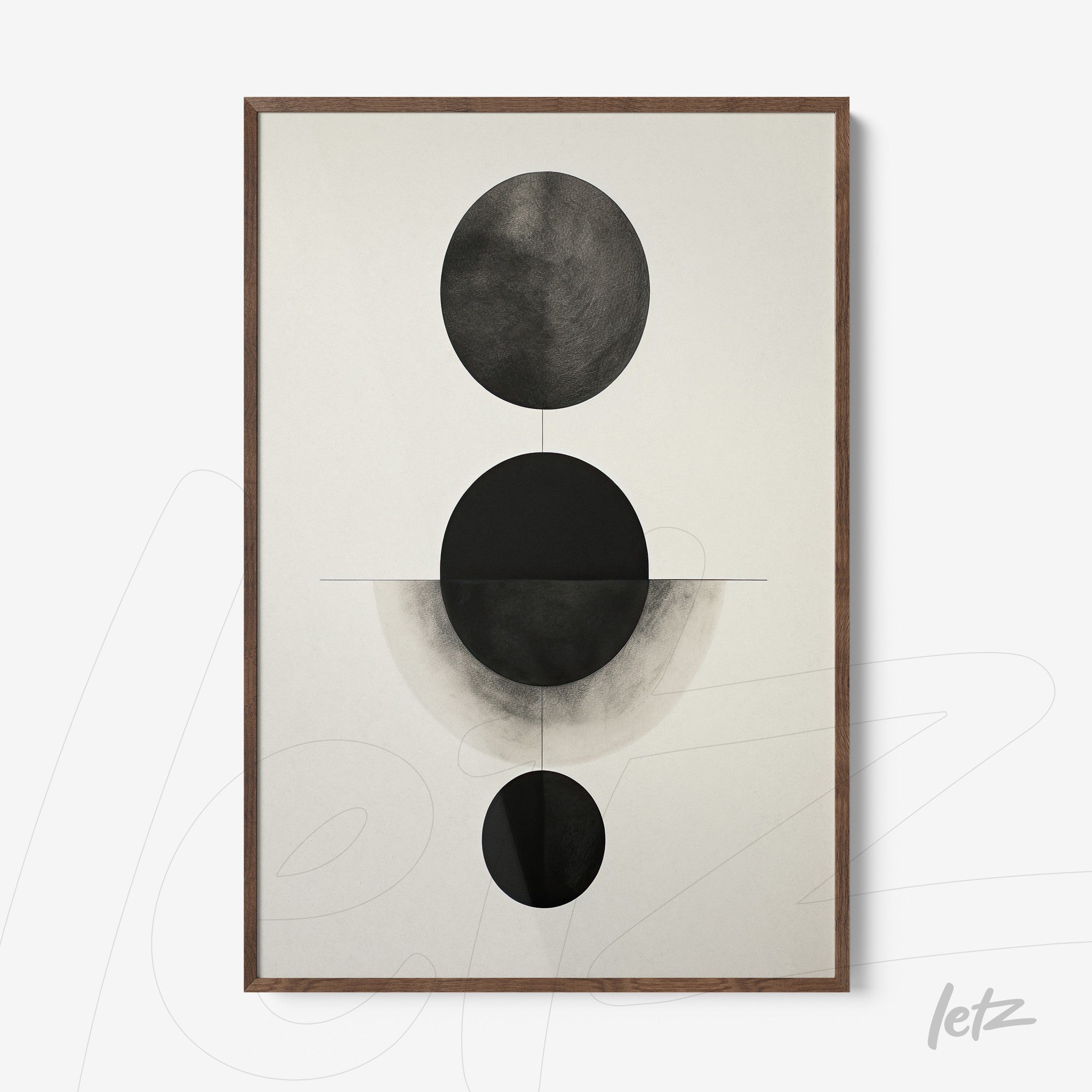 abstract wall art in black and white featuring circular shapes on a light background in dark wood frame