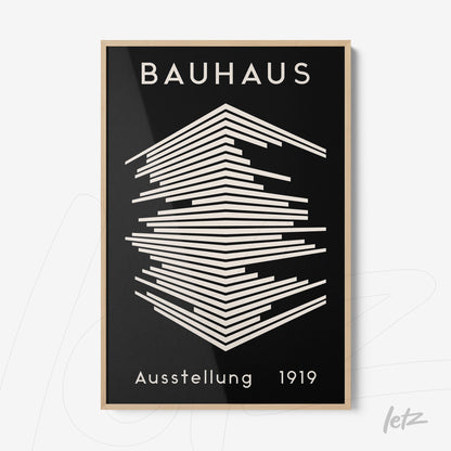 poster print in bauhaus style featuring abstract geometric design in black and white with light wood frame