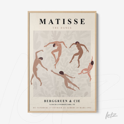 framed wall art featuring stylized dance figures in motion with a light wood frame