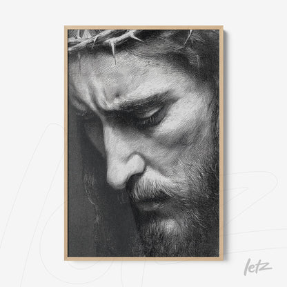 framed black and white portrait of Christ wearing a crown of thorns with a light wood frame