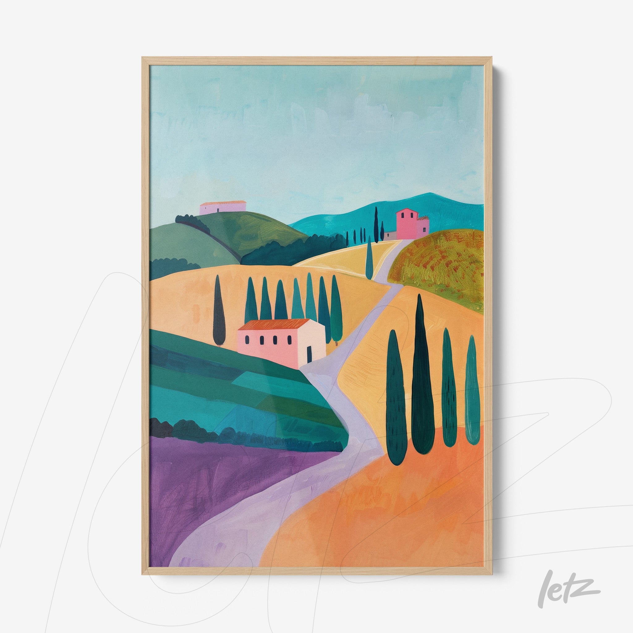 framed wall art featuring a rural landscape with green hills and colorful fields