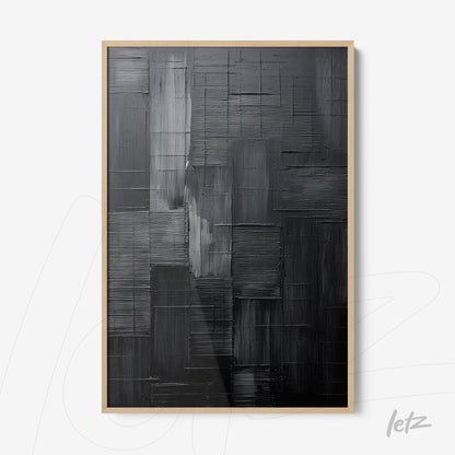 framed abstract wall art in shades of black and gray with light frame