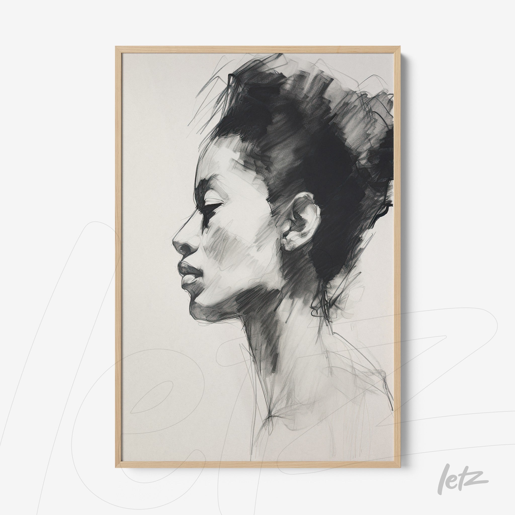 framed wall art featuring a pencil sketch portrait of a woman in profile with a light wood frame