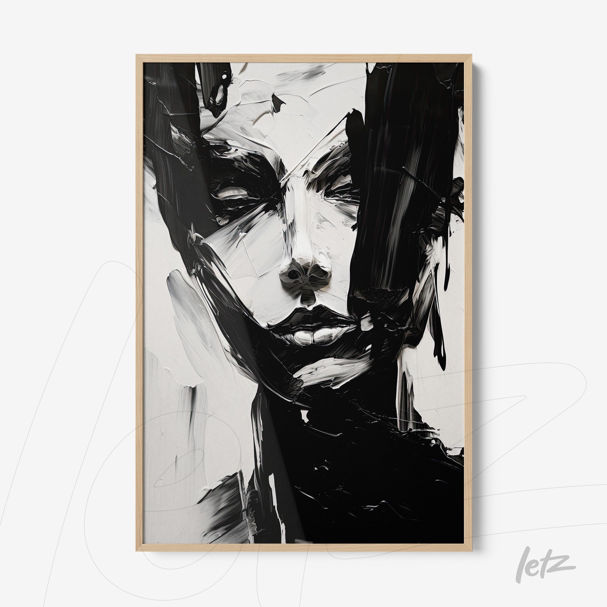 abstract wall art in black and white depicting a female face with light wood frame