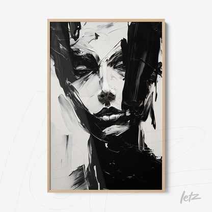 abstract wall art in black and white depicting a female face with light wood frame
