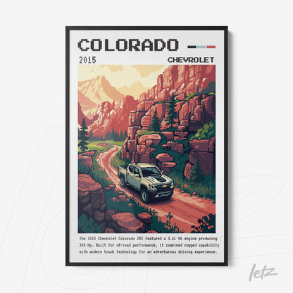 pixel art framed wall art featuring a Chevrolet Colorado truck on a mountainous road surrounded by trees and rocks