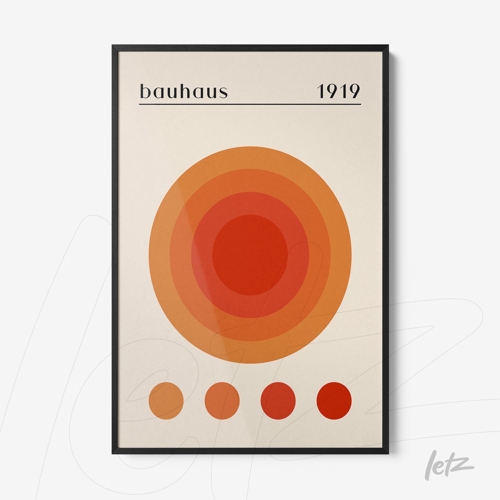 poster print featuring concentric circles in orange and red tones in a black frame