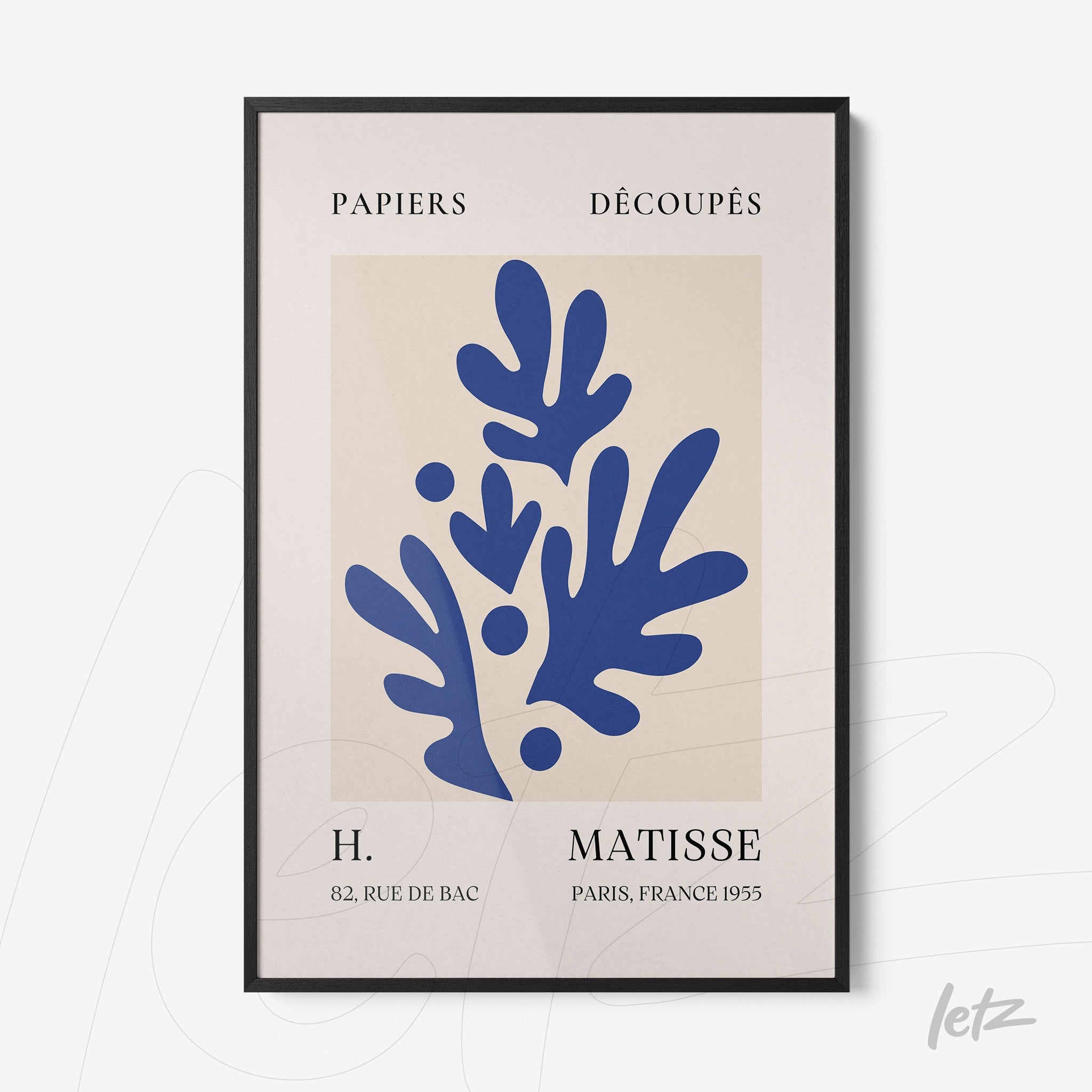 framed modern art print in blue featuring organic shapes on light background with black frame