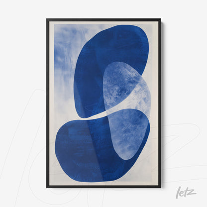 framed abstract art in blue on light background with black frame