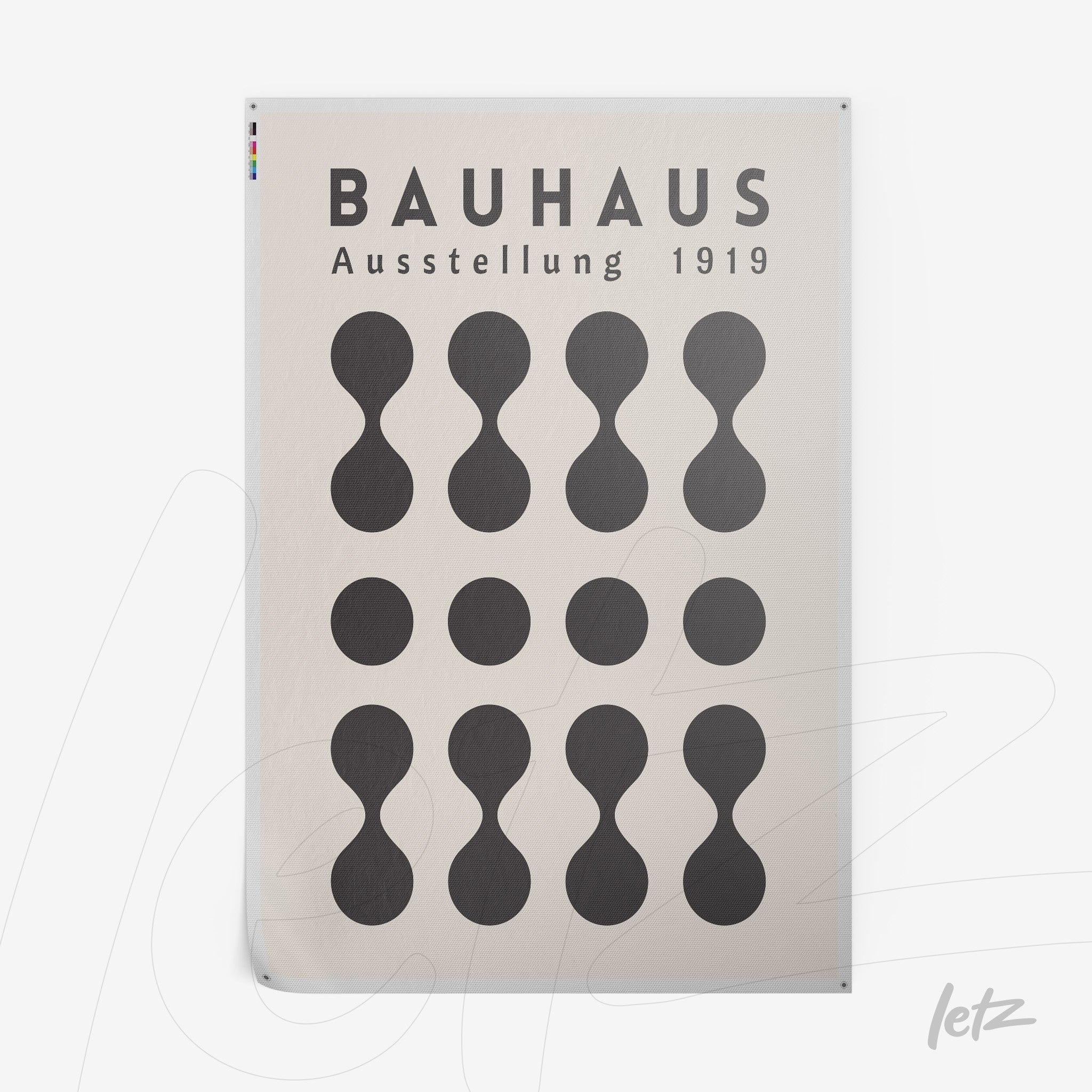 rectangular poster print with stylized circles illustration on beige background and text 'Bauhaus Ausstellung 1919'