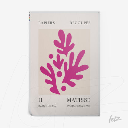 framed artwork featuring cut-out design by Henri Matisse in a light background with vibrant pink shapes